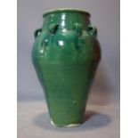 A Persian green glazed Sharab wine vessel, H.70cm