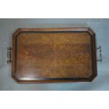 An early 20th century burr walnut and oak serving tray, with ebony cross banding and brass