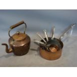 *WITHDRAWN* A collection of copper sauce pans together with a copper kettle