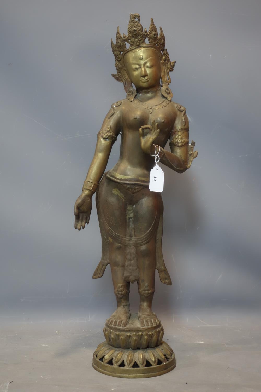 A Southeast Asian brass figure of a female deity on a lotus base, H.78cm - Image 2 of 4