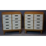 A pair of side chests of ten short drawers, on splayed legs, 60 x 70cm