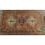 A Southwest Persian Afshar rug, triple pole medallion with repeating geometric motifs on a