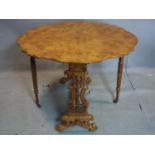 An late Victorian burr walnut drop leaf table, raised on castors, H.72 W.114 D.93cm