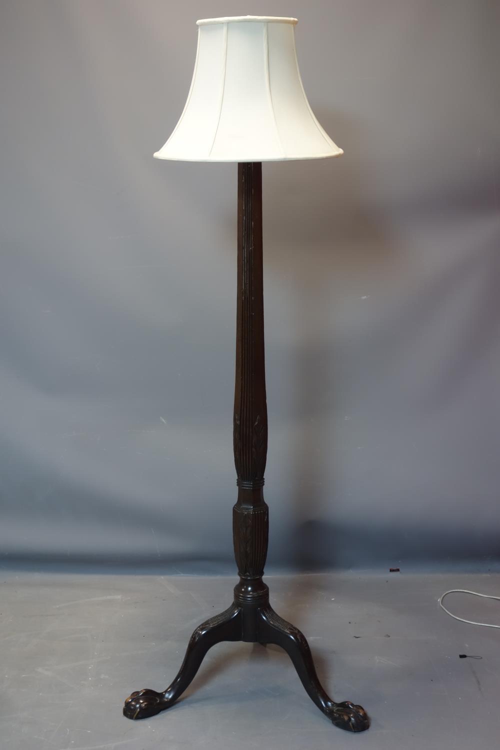A Regency style mahogany standard lamp, with reeded and floral support on ball and claw feet, H.