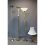 Three uplighter floor lamps, together with a Corinthian column table lamp