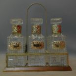 A set of three whisky decanters in carrying case