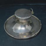 A silver capstan inkwell with glass liner, Birmingham 1923, having silver plated Golden Crown