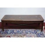 A low table with cross-banded top above frieze and legs decorated with repeating floral motifs and