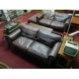 Two Fishpools leather sofas together with matching foot stool