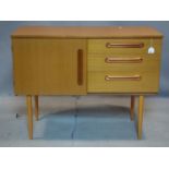 A 20th century schreiber teak cabinet, raised on tapered legs, H.77 W.100 D.43cm