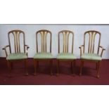 A set of 4 contemporary teak dining chairs