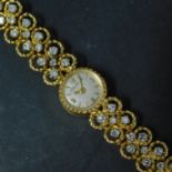 An 18ct yellow gold Jaeger LeCoultre ladies watch, set with 20 diamonds, back winder is loose