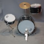 A child's drum kit by Session Pro consisting of three drums, foot pedal and high hat.