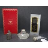 A collection of perfume and scent bottles, to include an boxed Santos de Cartier Eau de Toilette