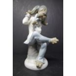 A Lladro model of a dog musician, H.20cm