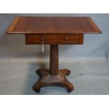 A 19th century mahogany work table with two drop leaves and one drawer, on octagonal support and