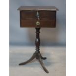 A Georgian style mahogany side table, with two drawers on tripod base, H.66 W.49 D.29cm