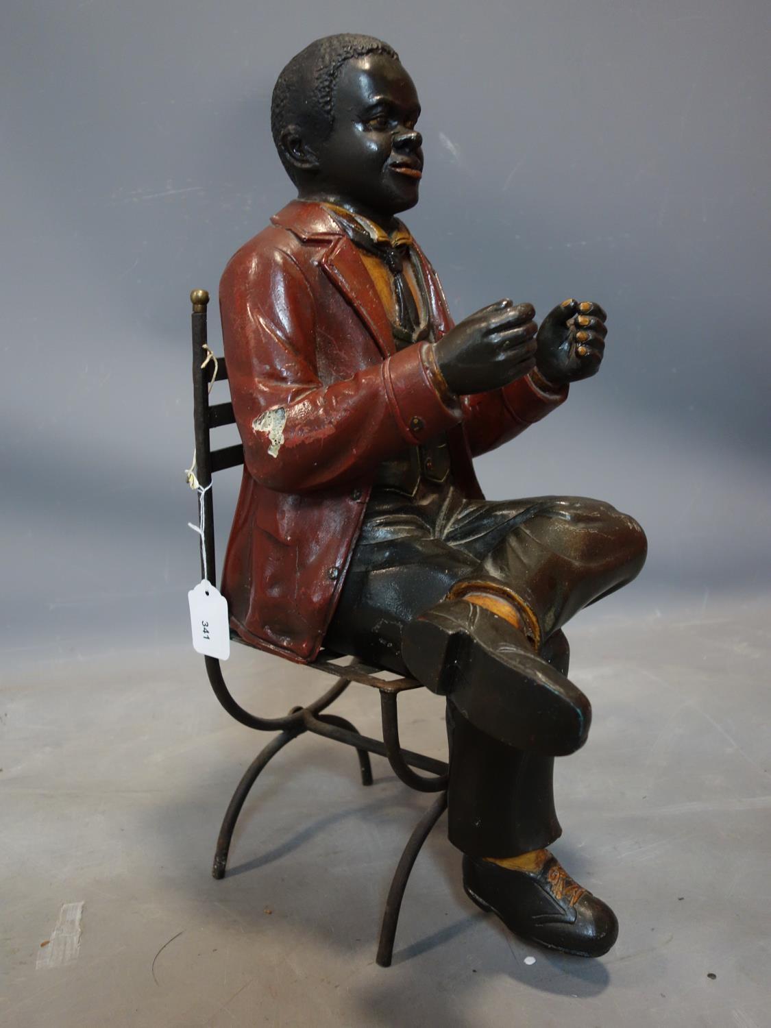 A fibreglass figure of a seated man, on a metal chair, H.55cm (man), H.43cm (chair) - Image 2 of 3