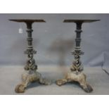 A pair of Victorian cast iron table bases, with dolphin supports, H.69cm