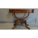 A Regency rosewood card table, with box wood inlay, raised on sabre legs and castors, H.75 W.92 D.