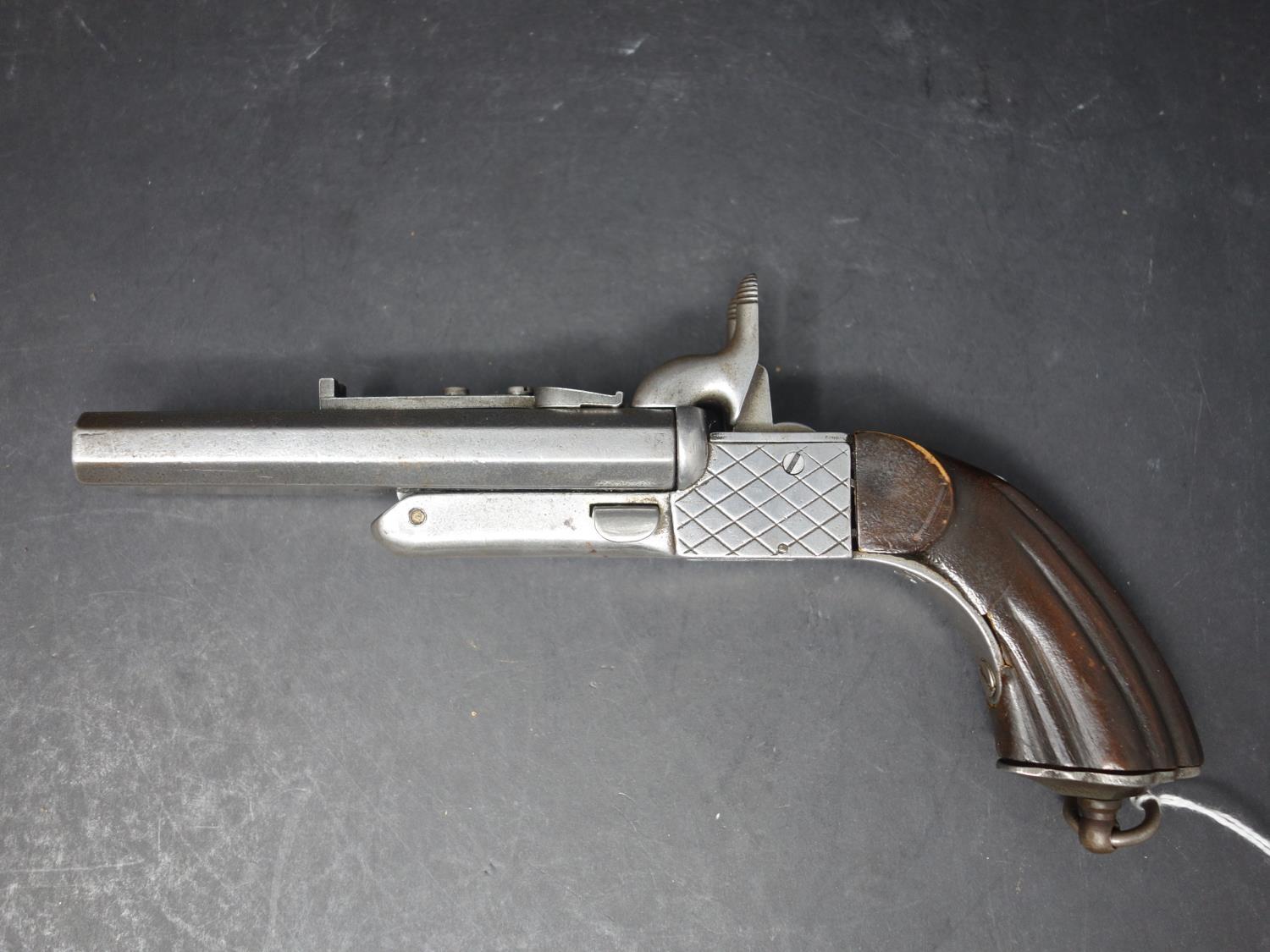 An antique double barrel percussion pistol