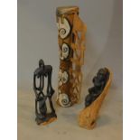 A tall carved and painted African drum and two carved hardwood African figures. H.55cm (tallest)