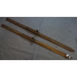 A pair of vintage c1920's oak skis including ski poles by Faucigny J. Amoudruz