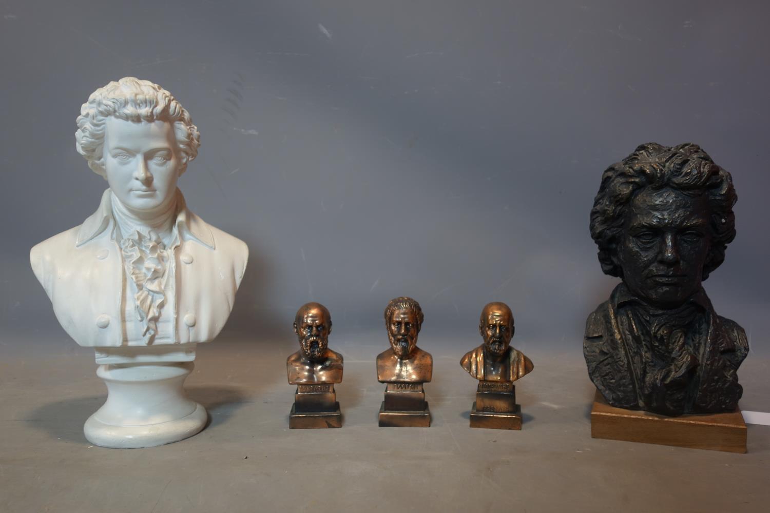 A collection of five busts to include Mozart, Beethoven and Greek philosopher. tallest H.45cm