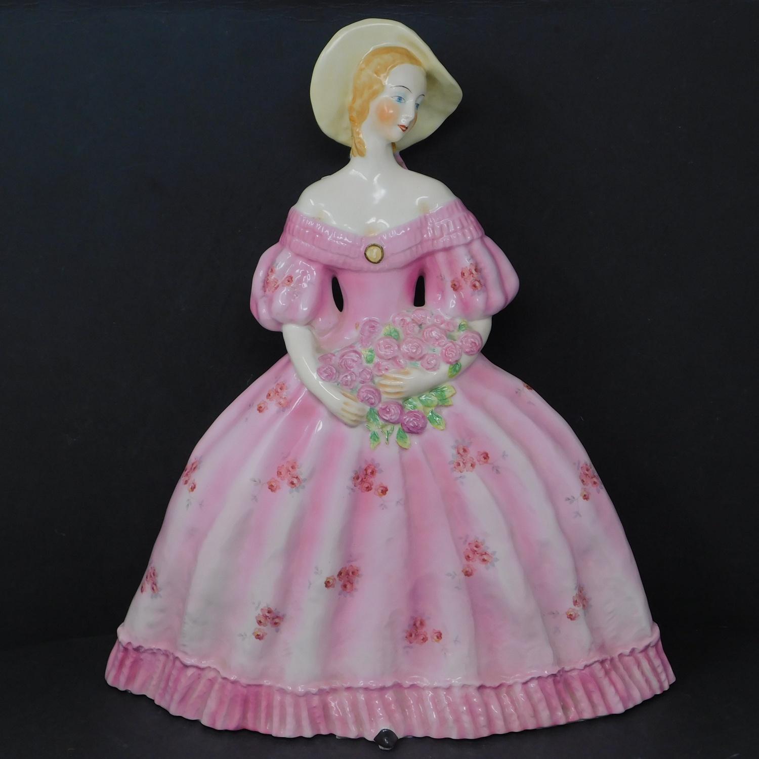 A Catherine Barjansky ceramic model of a lady with a bouquet of flowers, for Boch Frères Keramis,