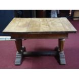 A 19th century oak draw leaf dining table, raised on reeded supports joined by stretcher, H.72 W.200