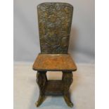 A Chinese carved hardwood chair, with floral carved decoration, H.97cm