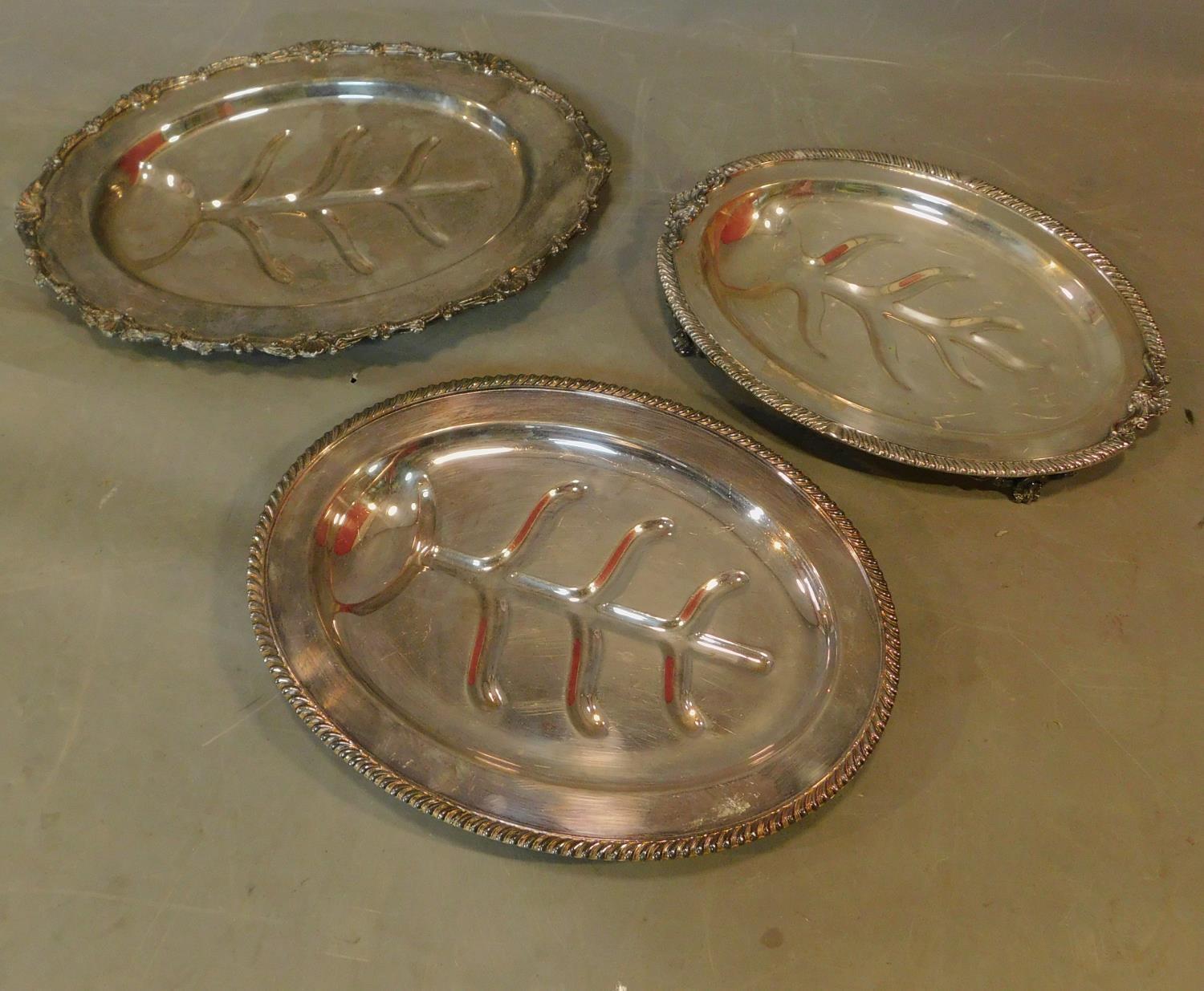 Three various silver plated meat dishes. L.49 W.36cm (largest)