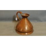An antique two gallon copper jug, with makers stamp 'EVW', H.34