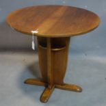 An Art Deco style walnut lamp table, H.60 D.70cm