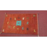 A woollen Moroccan style rug. 157 W.90cm