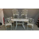 A vintage Coalbrookdale style white painted metal garden table and 6 chairs, H.75 W.153 D.92cm