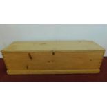 A Victorian pine hinged top blanket box with twin rope carrying handles. H.34 W.128 D.39cm