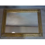 A large contemporary gilt framed mirror with bevelled plate, 112 x 80cm