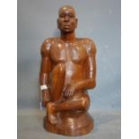 An African hardwood carving of a man, H.77cm