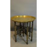WITHDRAWN - A 20th century Islamic brass top nomads table, H.54 D.56