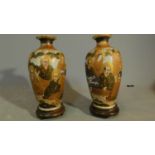 A pair of polychrome Chinese urns on stands H.22cm