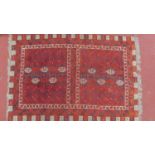 A Persian Rug with repeating geometric motifs, on a red ground, contained by geometric border, Rug