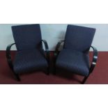 A pair of upholstered retro design armchairs H.82 W.62cm