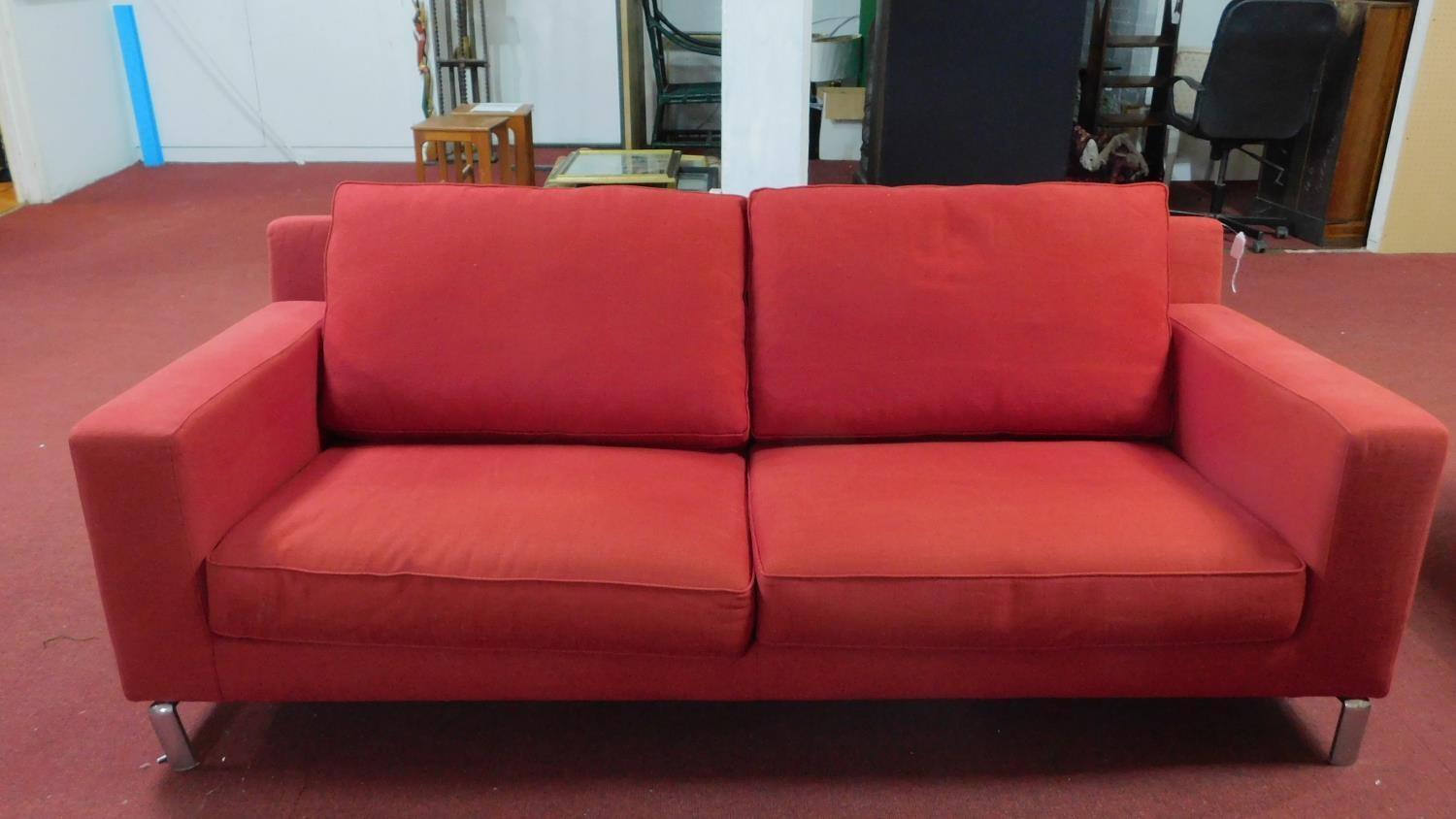A Molteni & C sofa raised on chrome supports, H.75 W.210 D.90cm