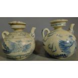 A pair of Chinese blue and white lidded teapots. H.15 W.13