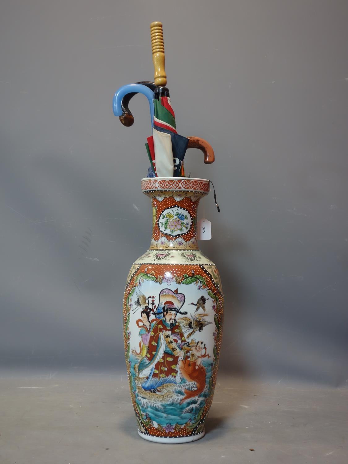 A large Japanese vase, decorated with figures, animals and flowers, to inlude a walking stick and