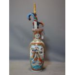 A large Japanese vase, decorated with figures, animals and flowers, to inlude a walking stick and