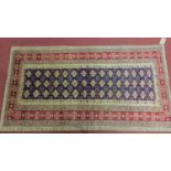 A north east Persian Turkoman rug, the repeating stylised tokeh motifs, on a sapphire ground,