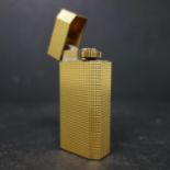 A vintage 'Les Must de Cartier' gold plated lighter in a fitted box, H.6cm