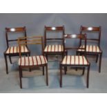 A set of four mahogany dining chair on sabre legs, together with a single dining chair with square